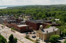 An aerial view of downtown shows the Labelon building just beyond Canandaigua City Hall. The imposing, boarded-up brick building at 10 Chapin St. has been vacant for decades. But developers want to renovate the structure into 52 apartments with first-floor commercial space. The city's targeted downtown revitalization district, awarded $10 million from the state, extends southward on either side of South Main St.