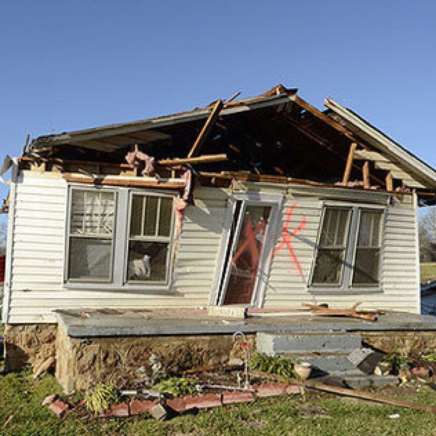 Friends and family help remove the contents from Kenneth Shull and Tina Woodruff's home on Johnson Bridge Road in Hildebran