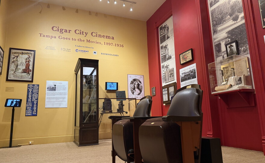 A multimedia exhibit in the Henry B. Plant Museum showcases historic film presentations, rare artifacts and other memorabilia, including two reproduced seats from the historic Tampa Theatre positioned in the middle of the room. 