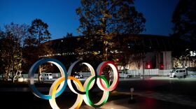 The Olympic rings displayed outside the National Stadium