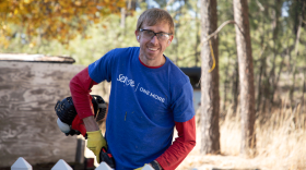 Ryan Whitehead helps clean up a yard for a neighbor in eastern Washington during a service day by Seventh-day Adventist church members on Nov. 13, 2025.