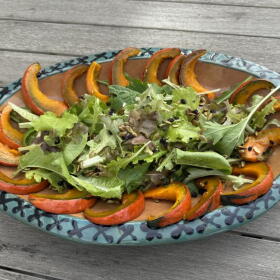 Maple-glazed squash salad with maple-glazed pumpkin seeds and currants and a maple syrup dressing. (Kathy Gunst/Here & Now)