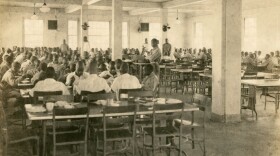 A group of boys sit in a dining hall at Dozier, circa 1940.