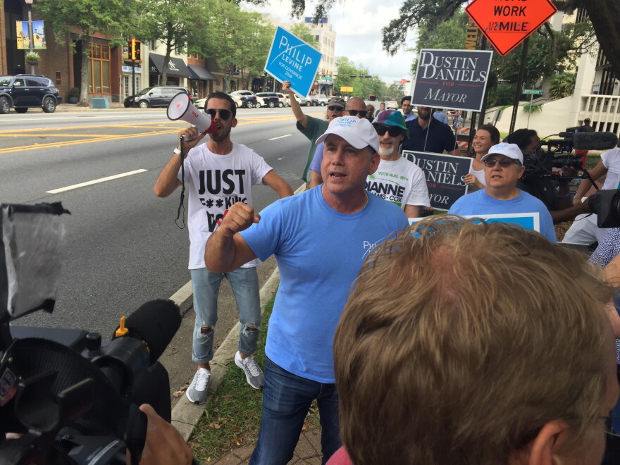 Democratic gubernatorial candidate Philip Levine talks with voters and media outside the Leon County Courthouse on August 22, 2018