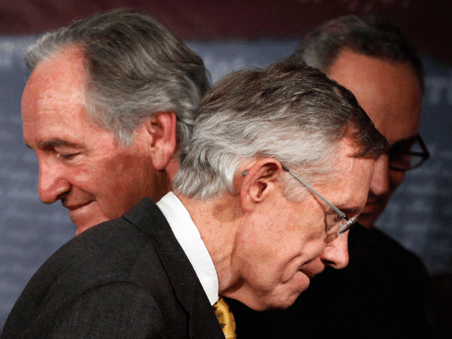 Majority Leader Harry Reid of Nevada passes fellow Democratic Sens. Tom Harkin of Iowa (left) and Charles Schumer of New York (right) while leaving a news conference this week on Capitol Hill.