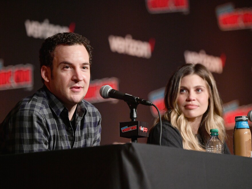 Ben Savage (left) and Danielle Fishel speak onstage at the Boy Meets World 25th Anniversary Reunion panel during New York Comic Con 2018. Savage announced this week he is running for Congress.