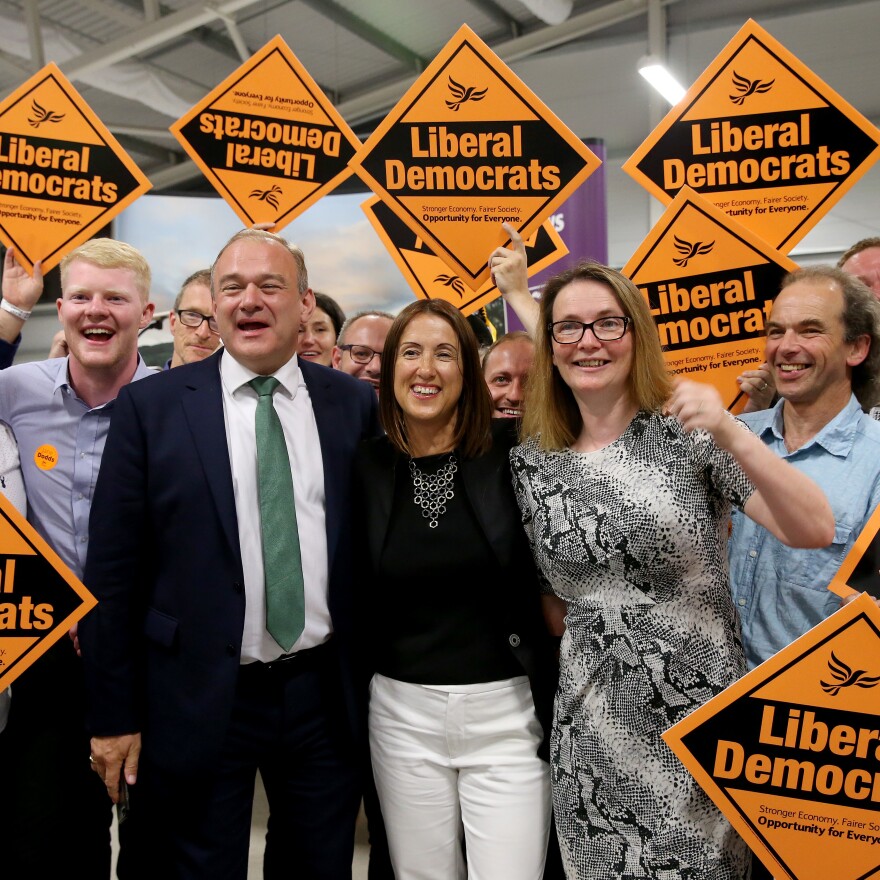 Liberal Democrat candidate Jane Dodds (center) celebrates her election victory with former Energy Secretary Ed Davey and Kirsty Williams, member of the Welsh Assembly, at Royal Welsh showground in Builth Wells, U.K., on Friday.