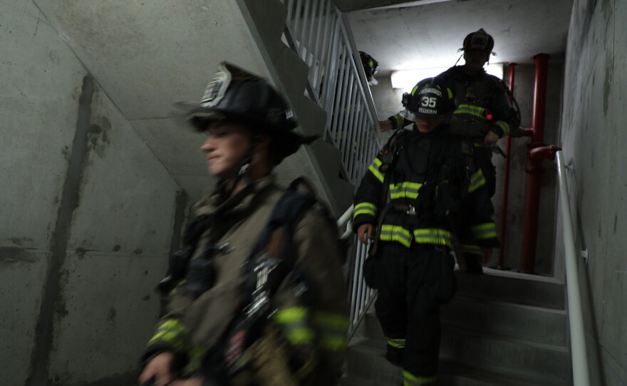 Firefighters participate in the 9-11 stair climb on Navarre Beach.