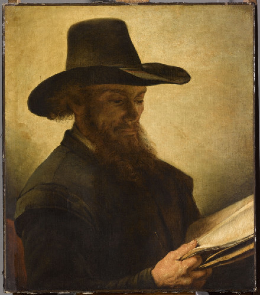 <em>Reading Man</em>, by the 17th-century Dutch painter Barent Fabritius, is one of the works featured in the two rooms of works lost to their Jewish owners.