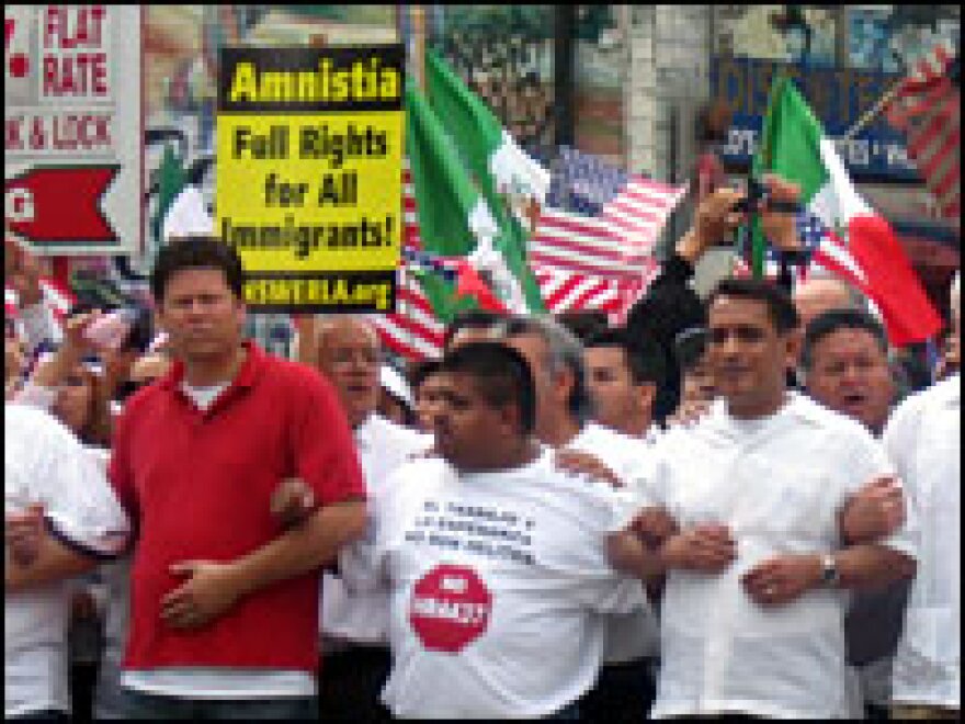 Marchers in downtown Los Angeles protest efforts to make it a felony to live in the United States without authorization, March 25, 2006.