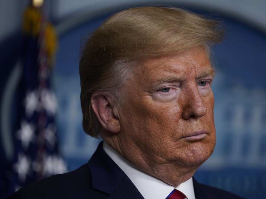 President Trump listens during a coronavirus task force briefing at the White House on Friday.