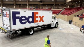 A volunteer watches as a driver completes the course at the state truck rodeo. The event was held at the Kansas Star Casino's indoor arena.