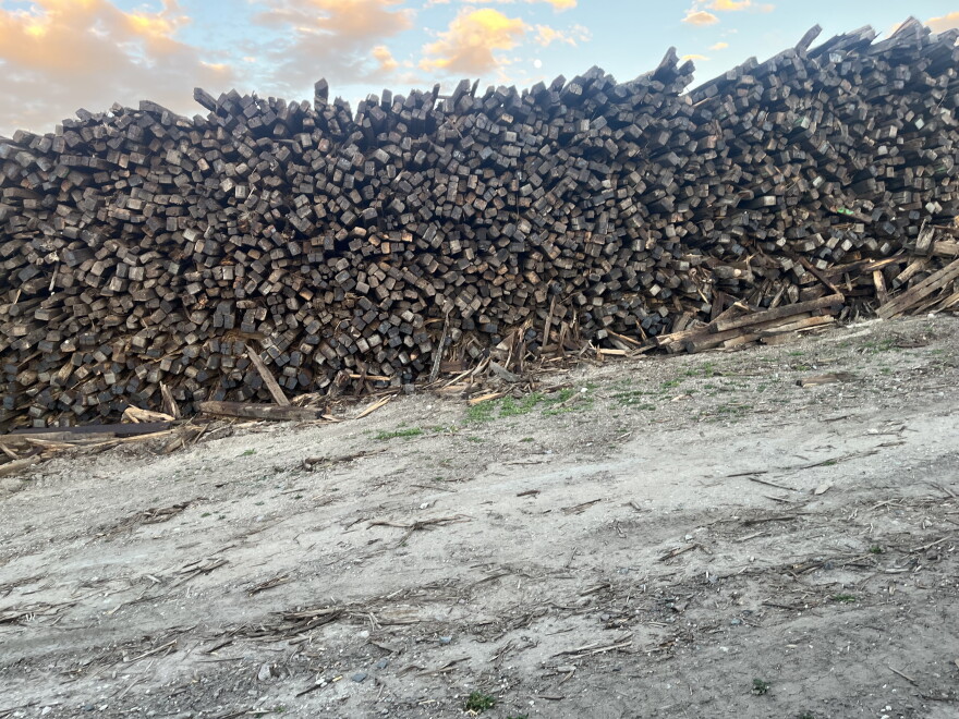 A large stack of railroad ties.