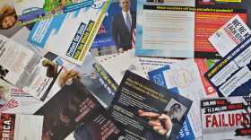 Campaign mailers sent to a residential address in Raleigh.