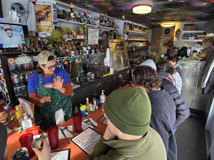 Lady Tron's diner is packed with customers during the lunch rush as the owners work to take orders
