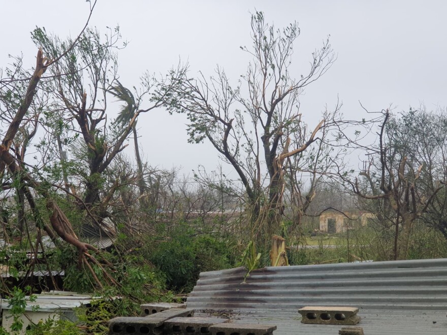 Debris covers the ground in Saipan on Wednesday, April 15, 2026, as a super typhoon with ferocious winds and relentless rains, shredded tin roofs and forced residents to take cover from flying tree limbs.