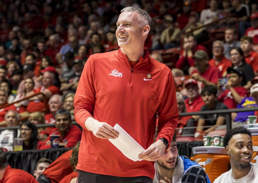 UNM head coach Eric Olen smiles as his team pulls away from Sam Houston during a game in the first round of the NIT on March 18 in the Pit.