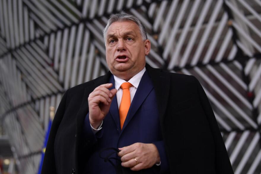 Hungary's Prime Minister Viktor Orban speaks as he arrives for an EU summit at the European Council building in Brussels, Thursday, Dec. 10, 2020. (John Thys/Pool via AP)