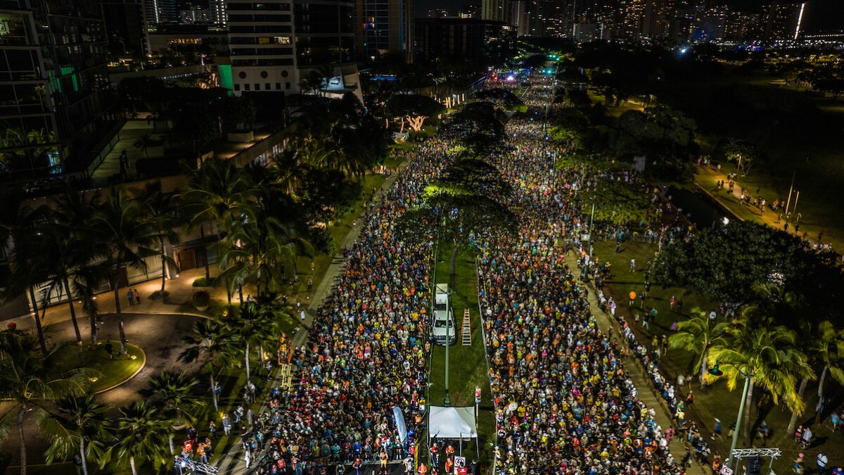 FILE - Runners line up on Ala Moana Boulevard for the 2022 Honolulu Marathon.