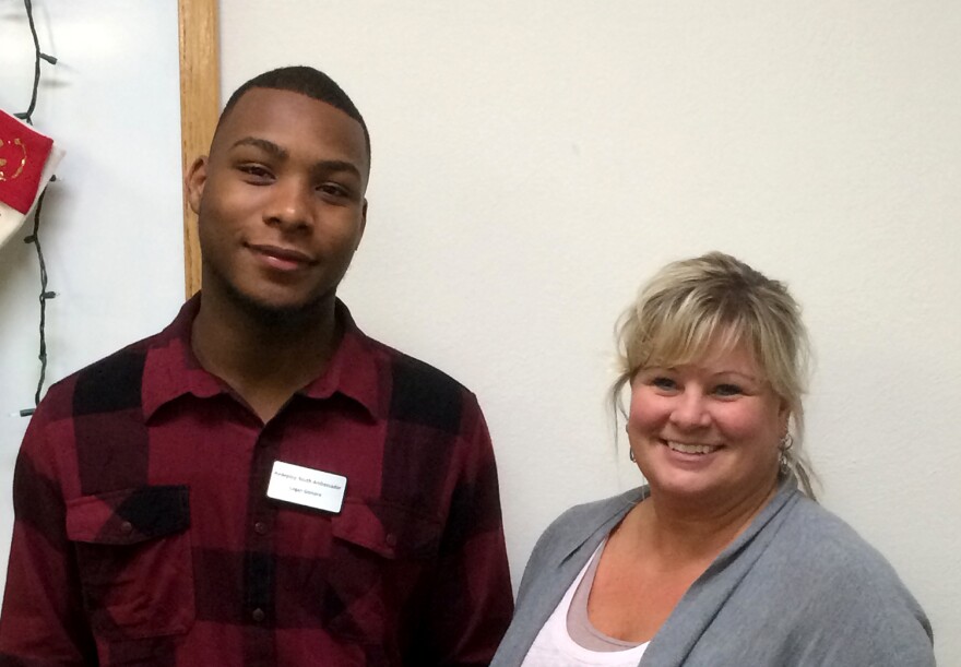 Redeploy youth ambassador Logan with staff member Lisa Durzo, one of four Metro East workers keeping her job with Redeploy. 