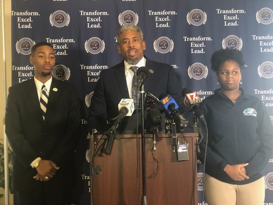 In a press conference on Feb. 19, 2024, Marcus Burgess, interim president of St. Augustine's University (center), addresses the ongoing financial and accreditation challenges facing the institution. Senior Miles Beasley (left) is a student member on the university's Board of Trustees. Ariana White (right) is president of the school's Student Government Association.