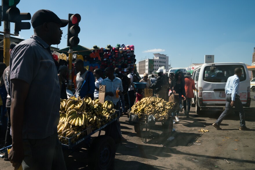 In an area of the city called Copacabana, the sidewalks are packed with people selling items of all kinds.