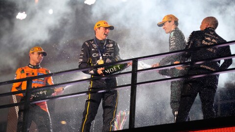 From left, second place finisher McLaren driver Lando Norris of Great Britain, first place finisher Red Bull driver Max Verstappen of the Netherlands, and third place finisher Mercedes driver George Russell of Great Britain celebrate after the Formula One Las Vegas Grand Prix auto race, Saturday, Nov. 22, 2025 in Las Vegas.
