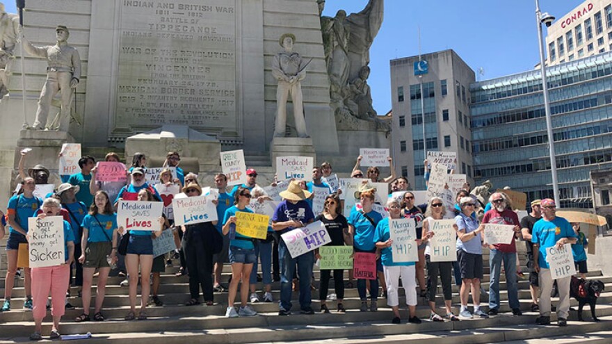 Protesters gather on Monument Circle to protest Indiana's Gateway to Work.