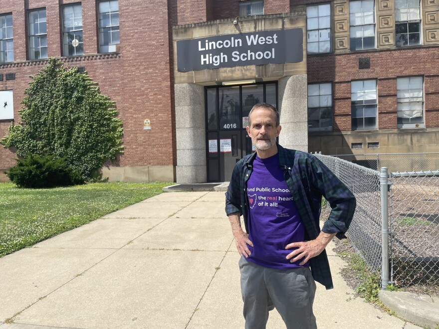 Piet van Lier, deputy director of Honesty for Ohio Education, stands outside Lincoln West High School in Ohio City, his neighborhood in Cleveland.