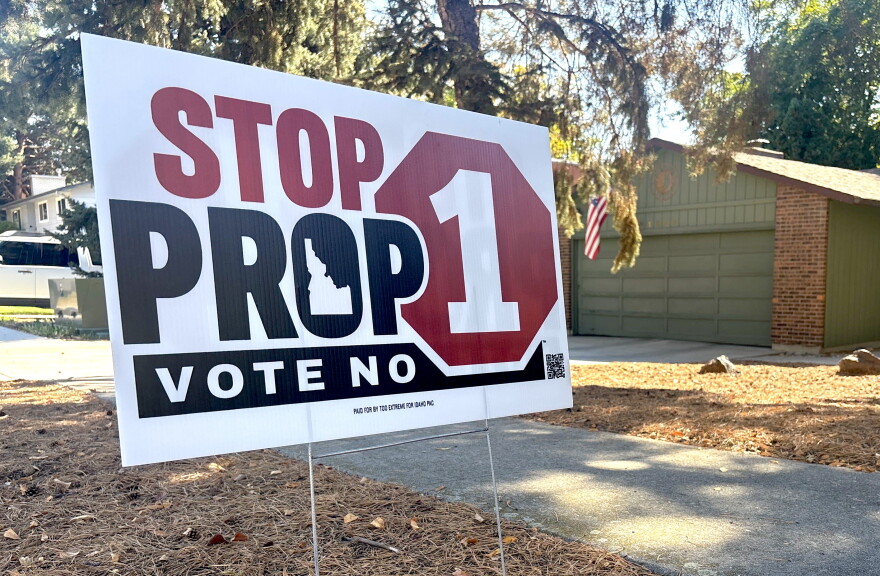 A close up of a yard sign against Proposition one. 