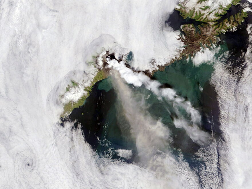 A satellite captured the erupting of the Okmok Caldera volcano on Umnak Island in Alaska in July 2008. The volcano spewed both steam and ash.