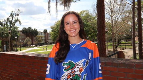 Marisa Bonilla, president of the Gator Women’s Hockey Team, smiles in her team jersey in Gainesville, Florida, on Monday, March 9, 2026. She helped build the program from the ground up, providing opportunities for women in hockey who have previously been limited in Florida.