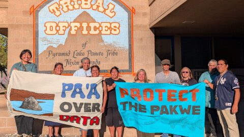 Members of the Pyramid Lake Paiute Tribe and the Water Over Data Alliance stand in front of the Tribal Offices in Nixon, Nevada on August 21.