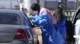 A health worker administers a measles test on Fernando Tarin, of Seagraves, Texas, at a mobile testing site outside Seminole Hospital District, Friday, Feb. 21, 2025, in Seminole, Texas.