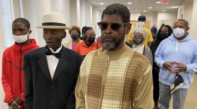 John Walker (left) and Darryl Boyd of the Buffalo 5 leave the courtroom after underlying charges relating to their 1976 arrest on murder charges were dismissed.