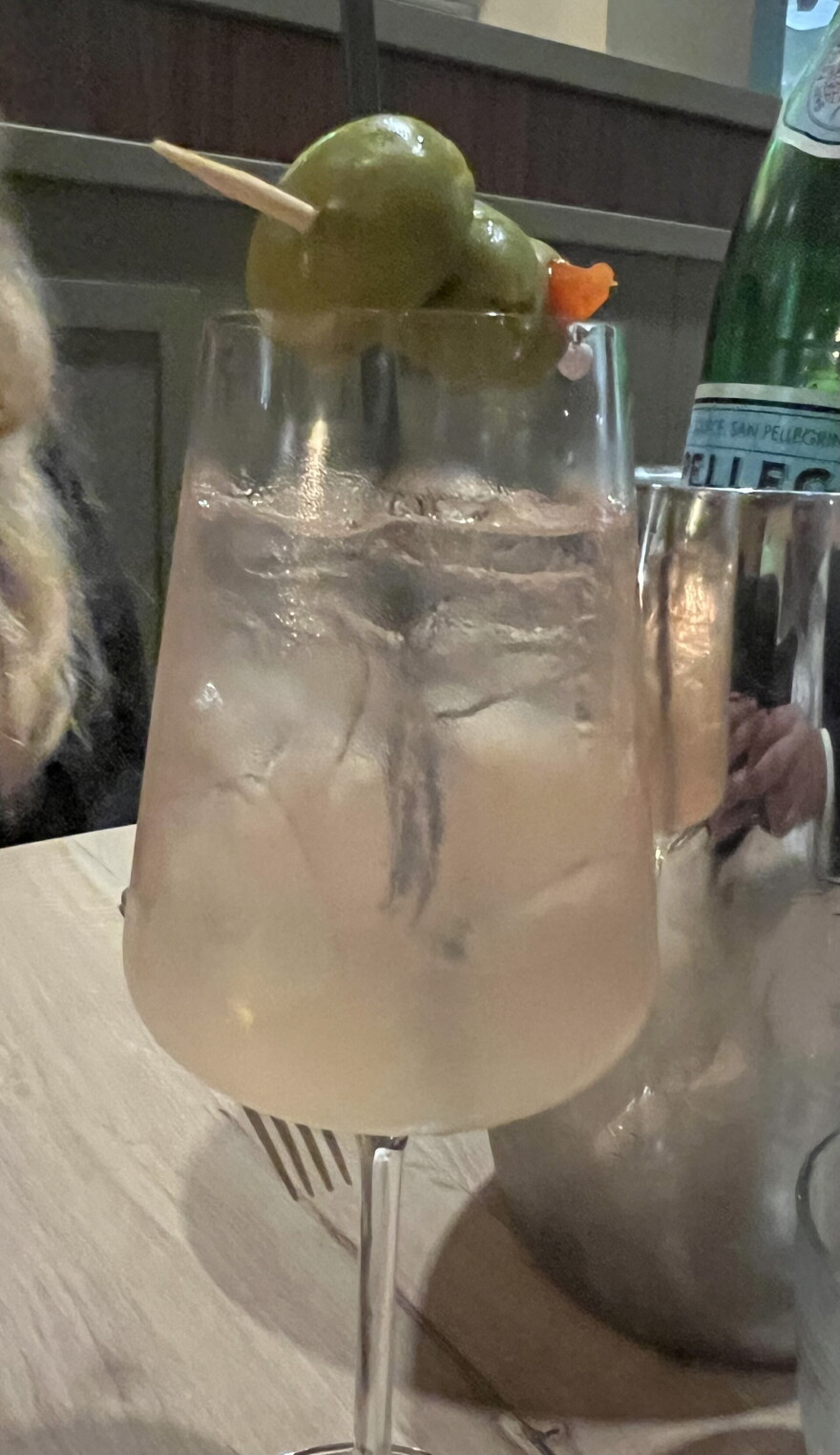 Il Ponte's bergamot spritz is made with bergamot liqueur, bergamot puree, olive brine, sparkling rose wine and an olive garnish.