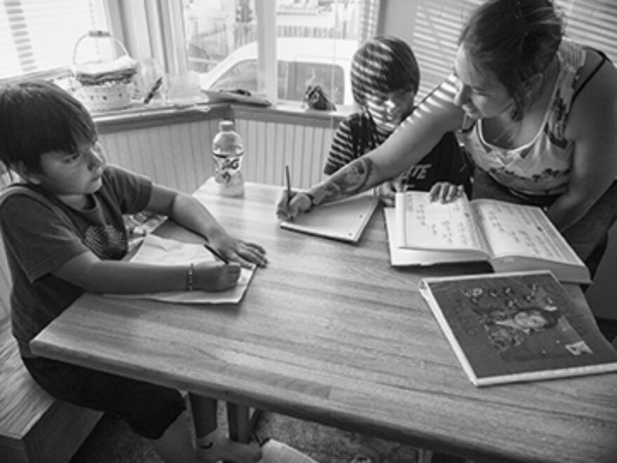 Nicole Pablo Helping Her Sons with Homework, Flathead Reservation, Montana, 2016 by Sue Reynolds for Everyday Native.