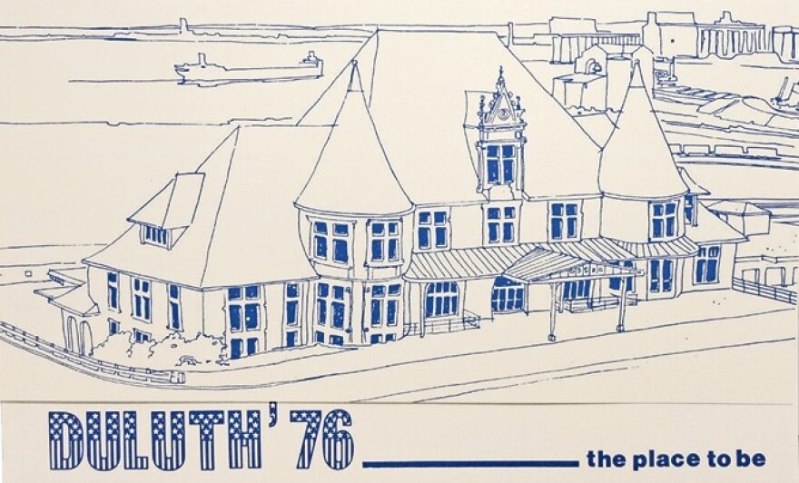 A blue ink illustration of a large conically peaked building with a large shipping vessel in the background; "Duluth '76 - the place to be" written across the bottom