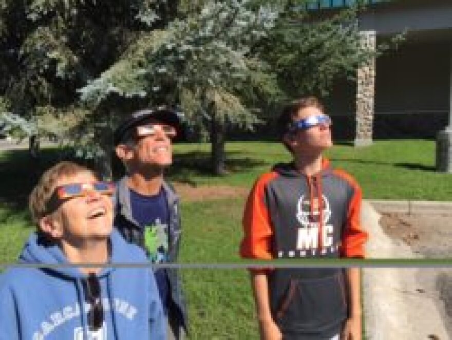 Mary and family viewing the solar eclipse