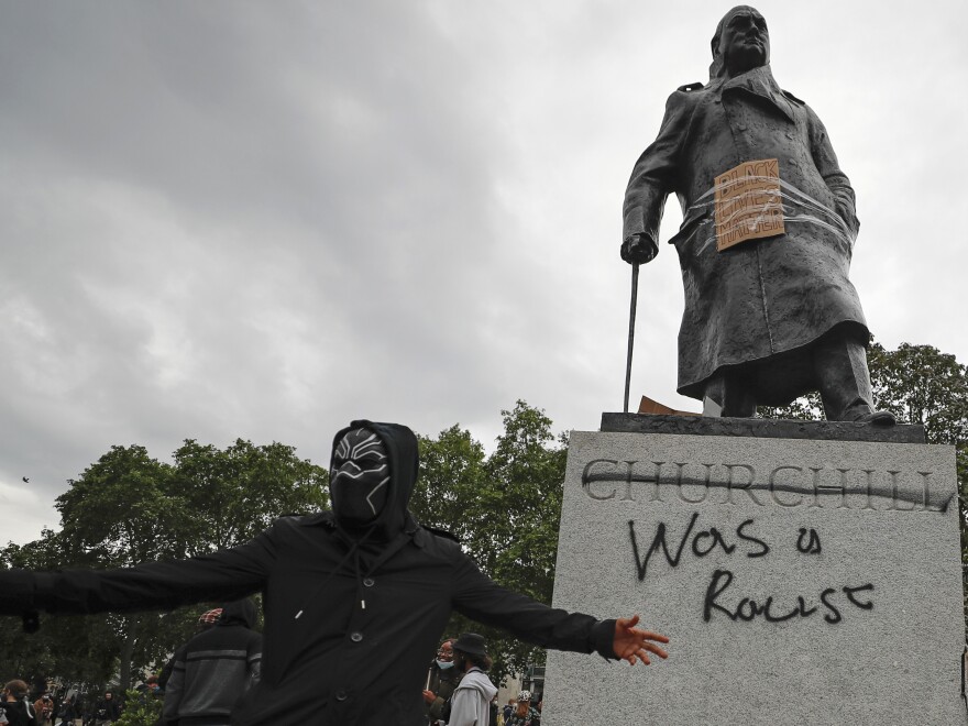 Protesters gather around the Winston Churchill statue in Parliament Square during a Black Lives Matter rally on Sunday in London.