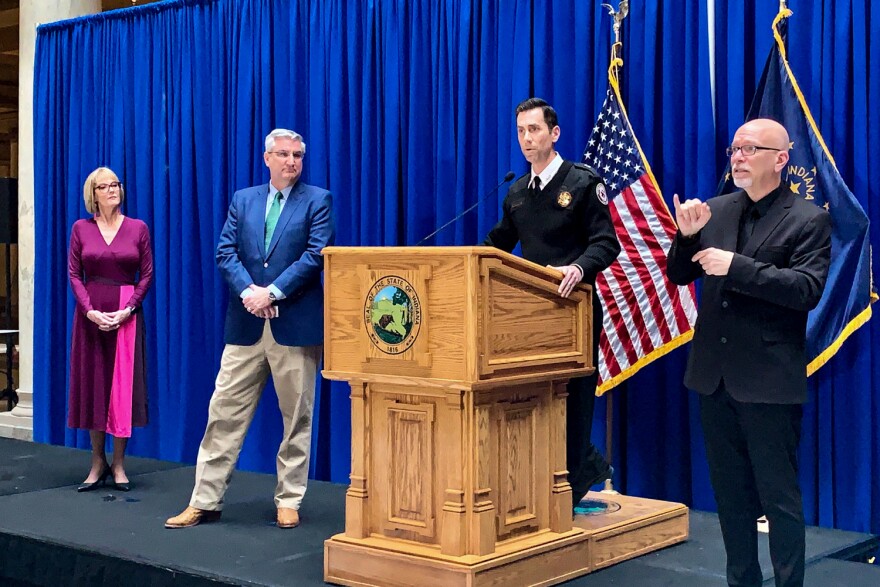 Gov. Eric Holcomb, second from left, and other officials give updates on the state's COVID-19 response.