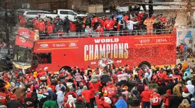  Kansas City Chiefs players, family, and staff move south on Grand Avenue during the Super Bowl victory parade on February 15, 2023.
