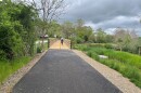 Dean Crane, Blacksburg's parks and recreation director, bikes on a new section of paved trail that leads into Heritage Park, called the Meadowbrook Greenway.