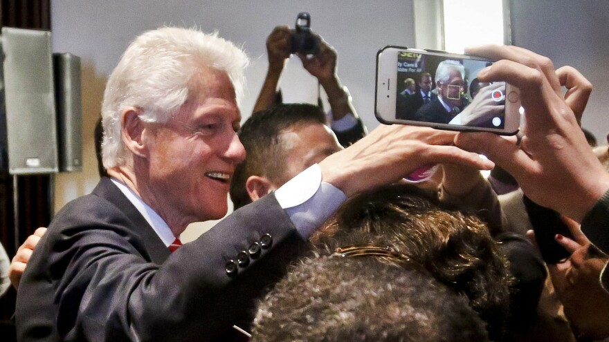 Former President Bill Clinton meets members of the 1199 health care union after speaking to the group during a campaign stop for Hillary Clinton in New York last month.