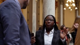 A member of the youth climate action group Confront the Climate Crisis talking to Sen. J.D. Ford (D-Indianapolis) at the climate rally at the Indiana Statehouse.
