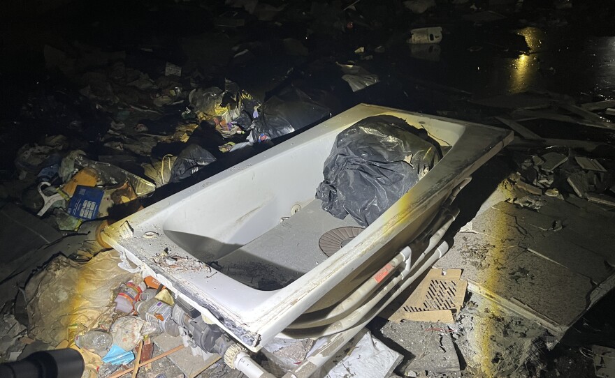Bathtub in trash pile at 26th & Peralta in Oakland