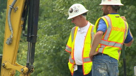 Smithville employees work to install updated fiber internet lines near Ellettsville. (Steve Burns, WFIU/WTIU News)