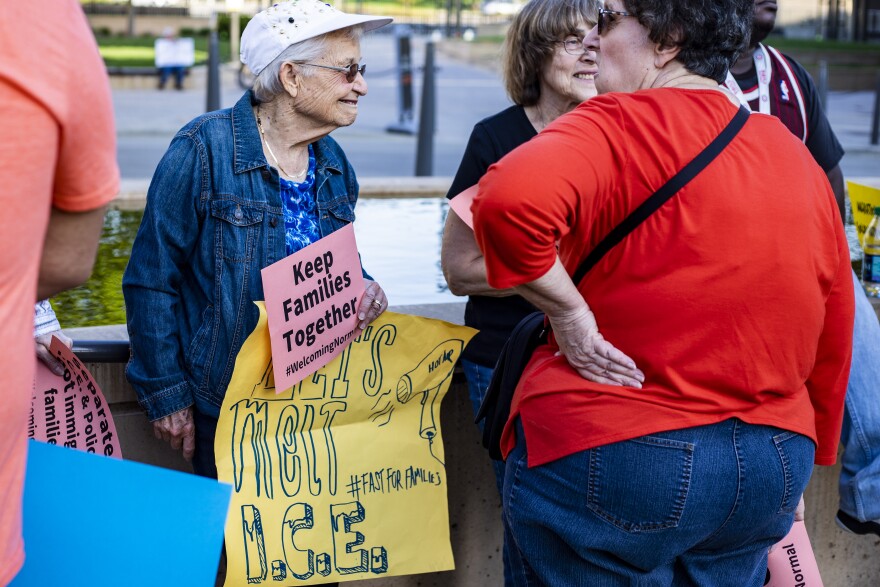Supporters of the Welcoming Community ordinance rally in Uptown Normal on Monday, May 7, 2018, before the Normal Town Council meeting.