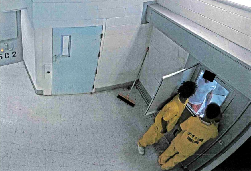 One of approximately 11 images included in disciplinary records against former Deputy Jail Commissioner Tammy Ross appears to show minors in close proximity to adult detainees. St. Louis Public Radio has redacted the face of an incarcerated man to protect his identity.