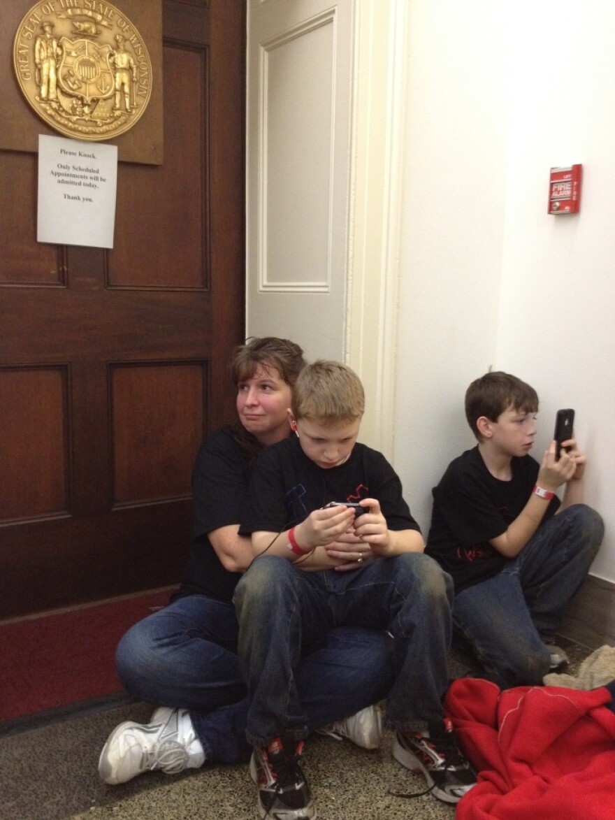 Kelley Albrecht of Wisconsin sat with her two sons outside Rep. Paul Ryan's office on Tuesday.